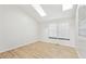 This bedroom has wood floors, natural light from the skylights, and a closet at 9621 W Chatfield Ave # F, Littleton, CO 80128