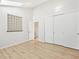Bedroom with wood floors, a closet, and window allowing natural light to enter at 9621 W Chatfield Ave # F, Littleton, CO 80128