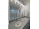 Bathroom featuring dual sinks, granite countertops, a large mirror, and modern lighting at 22023 E 38Th Pl, Aurora, CO 80019
