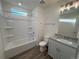 Bright bathroom with granite countertops, shower-tub combo, and neutral paint at 22023 E 38Th Pl, Aurora, CO 80019
