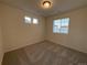 Bedroom features neutral carpet, recessed lighting and multiple windows for sunlight at 22023 E 38Th Pl, Aurora, CO 80019