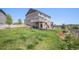 Picture of a spacious backyard featuring a deck, landscaped terraces, and a well-maintained lawn at 5929 Echo Hollow St, Castle Rock, CO 80104