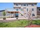 Backyard showcasing a deck, patio area, and neat landscaping, ideal for outdoor enjoyment and relaxation at 5929 Echo Hollow St, Castle Rock, CO 80104