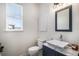 Half bathroom features a square vessel sink, marble countertop, and a window for natural light at 5929 Echo Hollow St, Castle Rock, CO 80104