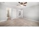 Empty bedroom features a view of a bathroom, with neutral walls and carpet at 5929 Echo Hollow St, Castle Rock, CO 80104