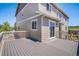 The back of this home features a walkout deck that overlooks the landscaped backyard and the rolling hills in the distance at 5929 Echo Hollow St, Castle Rock, CO 80104