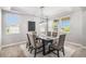 Elegant dining room with decorative lighting and ample natural light through multiple windows at 5929 Echo Hollow St, Castle Rock, CO 80104