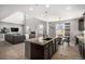 Open kitchen with island, granite countertops, and great flow to the living and dining areas at 5929 Echo Hollow St, Castle Rock, CO 80104