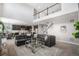 Open-concept living area flowing seamlessly into the dining and kitchen spaces at 5929 Echo Hollow St, Castle Rock, CO 80104