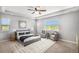 Spacious main bedroom with a tray ceiling, neutral tones, and large windows with outdoor views at 5929 Echo Hollow St, Castle Rock, CO 80104