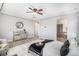Spacious main bedroom with a ceiling fan, neutral color palette, and an en-suite bathroom at 5929 Echo Hollow St, Castle Rock, CO 80104