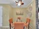 Bright dining area with glass table and four orange chairs at 2687 E Nichols Cir, Centennial, CO 80122