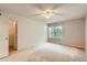 Neutral-toned bedroom features an overhead fan and an adjacent walk-in closet at 4081 Odessa St, Denver, CO 80249