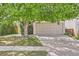 Charming home featuring a two-car garage, mature trees, and a well-maintained lawn at 4081 Odessa St, Denver, CO 80249