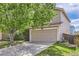 Charming home featuring a two-car garage, mature trees, and a well-maintained lawn at 4081 Odessa St, Denver, CO 80249
