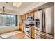This kitchen offers stainless steel appliances, including a refrigerator with a water dispenser at 4081 Odessa St, Denver, CO 80249