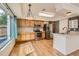 This kitchen features stainless steel appliances, ample wooden cabinetry, and hardwood floors at 4081 Odessa St, Denver, CO 80249