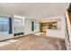 Open concept living room and kitchen featuring natural light and neutral decor at 4081 Odessa St, Denver, CO 80249