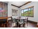 Recreation room with game table and chairs, hardwood floors, scenic views, and a novelty neon sign at 8278 Raphael Ln, Littleton, CO 80125