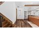 This hallway features hardwood floors and leads into the living room at 8278 Raphael Ln, Littleton, CO 80125