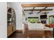 Bright living room featuring hardwood floors, fireplace, and seamless outdoor access at 8278 Raphael Ln, Littleton, CO 80125