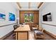 The private office boasts wood trim, exposed beams, and private yard views at 8278 Raphael Ln, Littleton, CO 80125