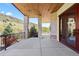 Spacious patio offers stone columns, a wood ceiling, with views of the beautiful, mountainous landscape at 8278 Raphael Ln, Littleton, CO 80125