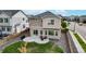 Wide shot of backyard, featuring a patio with seating and manicured lawn at 10109 Yampa St, Commerce City, CO 80022
