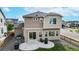 Back exterior of home and patio area with seating, perfect for entertaining at 10109 Yampa St, Commerce City, CO 80022