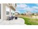 Relaxing patio area with outdoor seating and well-maintained lawn at 10109 Yampa St, Commerce City, CO 80022