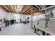 Unfinished basement featuring exposed beams, white walls, and concrete floor at 10109 Yampa St, Commerce City, CO 80022