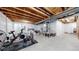 Spacious unfinished basement with exposed ceiling, plumbed for future bath at 10109 Yampa St, Commerce City, CO 80022