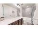 Well-lit bathroom featuring a shower-tub combination, a decorative mirror, and modern fixtures at 10109 Yampa St, Commerce City, CO 80022