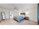 Bright bedroom with a ceiling fan, rustic wood bed frame, and neutral carpeting at 10109 Yampa St, Commerce City, CO 80022