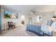 Cozy bedroom featuring a ceiling fan, desk, and an ensuite bathroom at 10109 Yampa St, Commerce City, CO 80022