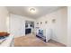 This carpeted bedroom features a crib and closet with ample storage space at 10109 Yampa St, Commerce City, CO 80022