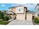 Inviting two-story home showcasing a three-car garage and well-maintained landscaping at 10109 Yampa St, Commerce City, CO 80022