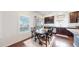 Inviting breakfast nook with dark wood table and bright, shuttered window at 10109 Yampa St, Commerce City, CO 80022