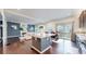 Open-concept kitchen with center island that flows into the living room at 10109 Yampa St, Commerce City, CO 80022