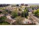 Aerial view of a multi-Gathering complex featuring mature trees and convenient access to nearby city at 3001 S Ursula Cir # 101, Aurora, CO 80014