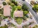 Aerial view of building exteriors showing mature trees, parking, and private entranceways at 3001 S Ursula Cir # 101, Aurora, CO 80014