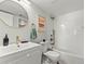 Bright bathroom featuring modern vanity with gold fixtures and a shower over tub with white subway tile at 3001 S Ursula Cir # 101, Aurora, CO 80014