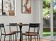 Bright dining area with modern table and chairs, natural light, and views of the outdoors at 3001 S Ursula Cir # 101, Aurora, CO 80014