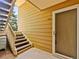 Multi-Gathering unit entrance featuring exterior stairwell with access to unit, and a screen door at 3001 S Ursula Cir # 101, Aurora, CO 80014