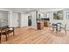 Open concept living space with modern kitchen, dining area, and sleek flooring for a contemporary lifestyle at 3001 S Ursula Cir # 101, Aurora, CO 80014