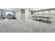 Finished basement with exercise equipment and a ping pong table, perfect for recreation and fitness at 6469 Barnstead Dr, Castle Pines, CO 80108