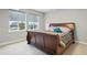 Comfortable bedroom with a large bed, plush pillows, and natural light from the window at 6469 Barnstead Dr, Castle Pines, CO 80108