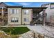 Beautiful two-story home with an outdoor staircase and meticulously landscaped yard at 6469 Barnstead Dr, Castle Pines, CO 80108