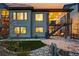 Stunning two-story home featuring an outdoor staircase leading to a covered patio at 6469 Barnstead Dr, Castle Pines, CO 80108