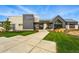 Attractive building exterior featuring modern design, stone accents, and well-manicured landscaping at 6469 Barnstead Dr, Castle Pines, CO 80108
